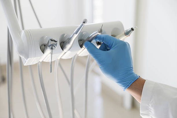 Professional Tooth Extraction technician working in De Motte, IN